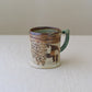 bison and flowers mug